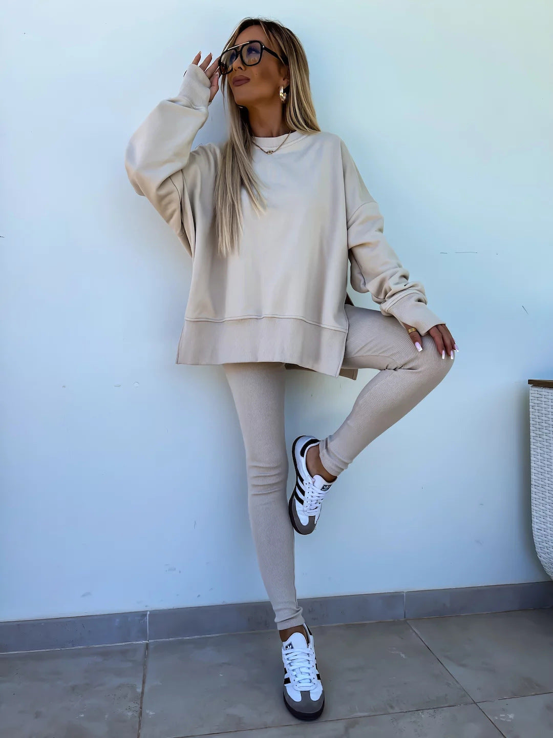 Spring sweater suit women's European and American casual loose long-sleeved round neck split top tight trousers